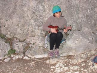 Pale. Roberta playing the ukelele